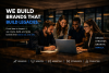 Professionals collaborating around a laptop in a modern office with headline “We Build Brands That Build Legacies.”